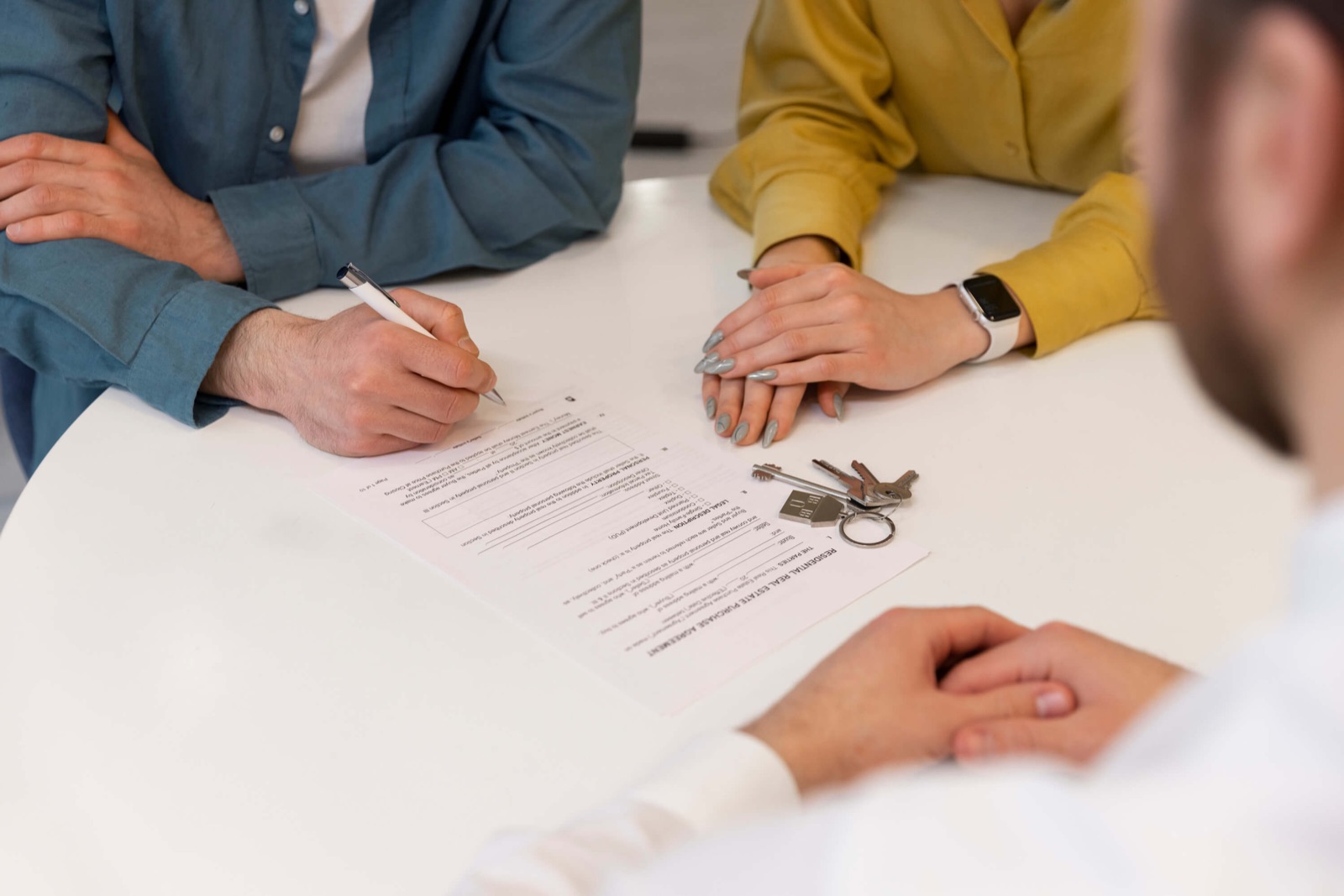 An agent going through paperwork with a couple
