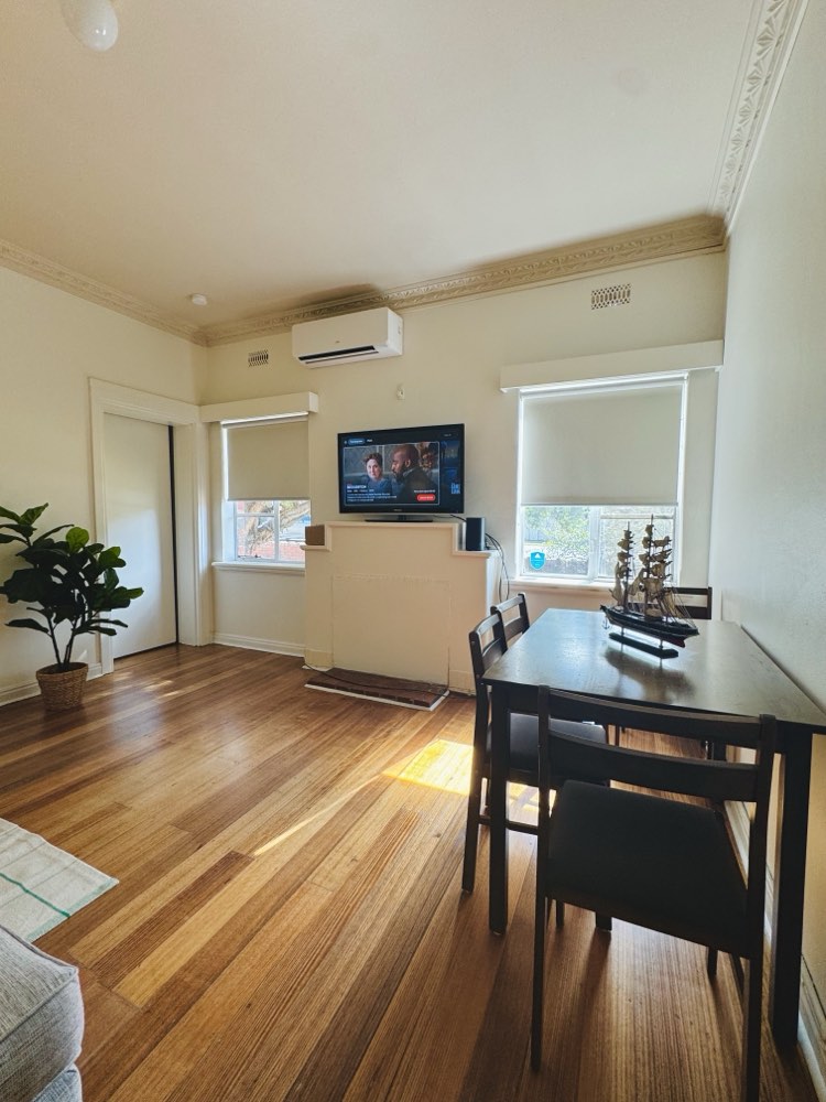 A living and dining room Middow furnished in Malvern East